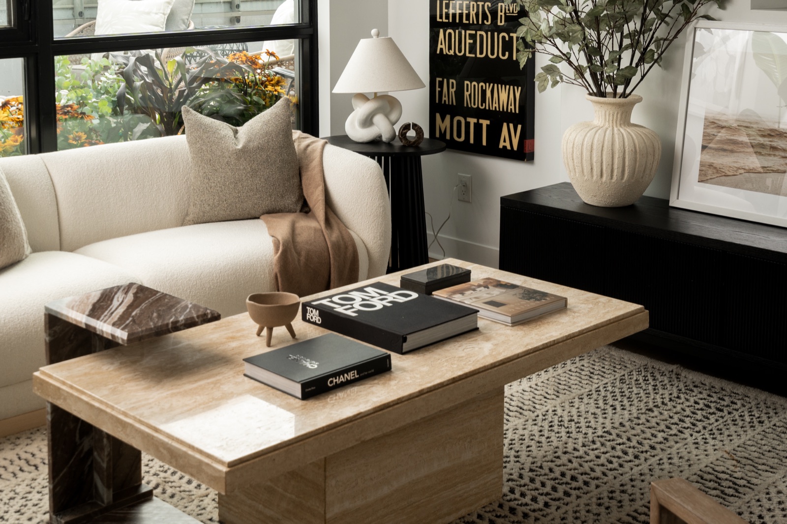 Travertine coffee table and boucle sofa