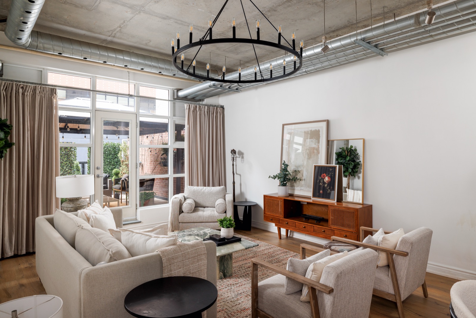 Loft living room under the iron ring chandelier