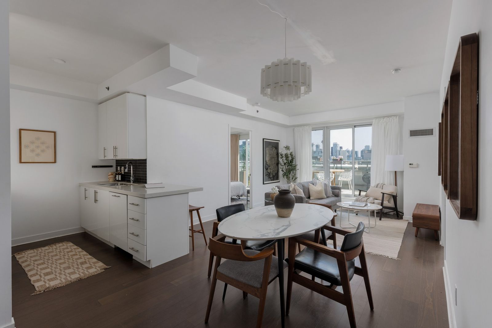 Open kitchen, dining and living room with a sculptural chandelier, Portland Street